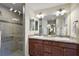 Bathroom with double sinks, granite countertop at 2080 Nordic Ln, The Villages, FL 32163