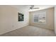 Bright bedroom with window shutters and wall-to-wall carpet at 2080 Nordic Ln, The Villages, FL 32163