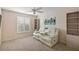 Relaxing bonus room featuring plush seating and built-in shelving at 2080 Nordic Ln, The Villages, FL 32163