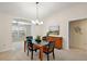 Elegant dining area with a chandelier and hardwood floors at 2080 Nordic Ln, The Villages, FL 32163