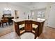 Kitchen island with granite countertop and under-cabinet lighting at 2080 Nordic Ln, The Villages, FL 32163