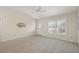 Spacious living room with carpeted floors and a large window at 2080 Nordic Ln, The Villages, FL 32163