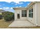 Private patio with concrete flooring and a door leading inside at 2080 Nordic Ln, The Villages, FL 32163