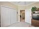 Bedroom with a view into another room and a large closet at 2202 Blackville Dr, The Villages, FL 32162