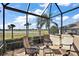 Relaxing screened porch overlooking a golf course at 2202 Blackville Dr, The Villages, FL 32162