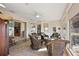 Relaxing sunroom with wicker furniture and a view of the golf course at 2202 Blackville Dr, The Villages, FL 32162