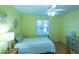 Cozy bedroom with a single bed, lamp, and window shutters at 2219 Welcome Way, The Villages, FL 32162