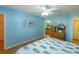 Bedroom with light blue walls and built-in dresser at 2219 Welcome Way, The Villages, FL 32162