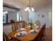 Bright dining room with wood table and chairs, ready for gatherings at 2219 Welcome Way, The Villages, FL 32162