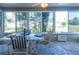 Sunroom with table, chairs, and view of backyard at 2219 Welcome Way, The Villages, FL 32162