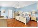 Spacious Primary bedroom with light wood floors and a king-size bed at 2304 Jonebury Run, The Villages, FL 32162