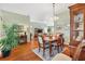 Formal dining room featuring hardwood floors and a wood dining set at 2304 Jonebury Run, The Villages, FL 32162