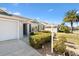 Home's exterior showcasing a well-maintained landscape and driveway at 2304 Jonebury Run, The Villages, FL 32162