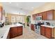 Spacious kitchen with stainless steel appliances and an island at 2304 Jonebury Run, The Villages, FL 32162