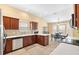 Modern kitchen featuring stainless steel appliances and light wood cabinets at 2304 Jonebury Run, The Villages, FL 32162