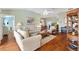 Comfortable living room with hardwood floors and neutral colored furniture at 2304 Jonebury Run, The Villages, FL 32162