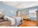 Spacious main bedroom with light blue walls and wood floors at 2304 Jonesbury Run, The Villages, FL 32162