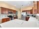 Well-equipped kitchen with stainless steel appliances and quartz countertops at 2304 Jonesbury Run, The Villages, FL 32162