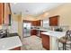 Modern kitchen with stainless steel appliances and an island at 2304 Jonesbury Run, The Villages, FL 32162