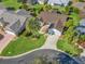 Aerial view of single Gathering home with landscaped yard and driveway at 2338 Mcclellanville Ter, The Villages, FL 32162