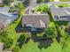 Aerial view of the house and surrounding neighborhood, highlighting the property's location at 2338 Mcclellanville Ter, The Villages, FL 32162