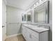 Double vanity bathroom with granite countertops at 2338 Mcclellanville Ter, The Villages, FL 32162