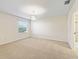 Bright bedroom with neutral walls and carpeted floor at 2338 Mcclellanville Ter, The Villages, FL 32162