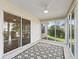 Cozy screened porch overlooking the backyard at 2338 Mcclellanville Ter, The Villages, FL 32162