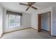 Well-lit bedroom with a window, closet, and ceiling fan at 2355 Lakeview Ave, Clermont, FL 34711