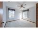 Bright bedroom featuring two windows and a ceiling fan at 2355 Lakeview Ave, Clermont, FL 34711