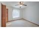 Well-lit bedroom with ceiling fan and closet at 2355 Lakeview Ave, Clermont, FL 34711