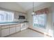 Bright kitchen featuring white appliances and light wood cabinets at 2355 Lakeview Ave, Clermont, FL 34711