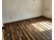 Vacant bedroom showcasing hardwood flooring and plain painted walls at 2438 Centennial Blvd, Leesburg, FL 34748