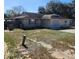 Picture of a one story home with a garage, small yard and traditional architectural style at 2438 Centennial Blvd, Leesburg, FL 34748