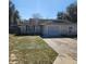 Single-story home features an attached garage and traditional architectural style at 2438 Centennial Blvd, Leesburg, FL 34748