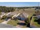 Aerial view of a house and surrounding neighborhood at 24506 Woodhill Ct, Sorrento, FL 32776