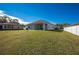 Large backyard with grassy area at 24506 Woodhill Ct, Sorrento, FL 32776