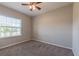 Spacious bedroom with carpeted floor and ceiling fan at 24506 Woodhill Ct, Sorrento, FL 32776