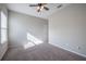 Bright bedroom featuring carpet and ceiling fan at 24506 Woodhill Ct, Sorrento, FL 32776