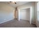 Bedroom with carpeted floor, ceiling fan and walk in closet at 24506 Woodhill Ct, Sorrento, FL 32776