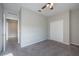 Bedroom with carpet, ceiling fan and double doors at 24506 Woodhill Ct, Sorrento, FL 32776