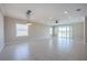 Bright dining room with tile flooring, sliding glass doors, and a ceiling fan at 24506 Woodhill Ct, Sorrento, FL 32776