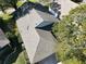 Aerial view of a house showcasing a gray asphalt shingle roof at 24947 Cranes Roost Cir, Leesburg, FL 34748