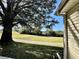 View of a golf course and lake from the backyard at 24947 Cranes Roost Cir, Leesburg, FL 34748