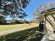 View of a golf course and lake from the backyard at 24947 Cranes Roost Cir, Leesburg, FL 34748