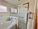 Bathroom with shower and tub combo at 24947 Cranes Roost Cir, Leesburg, FL 34748