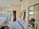 Main bathroom with double vanity and garden tub at 24947 Cranes Roost Cir, Leesburg, FL 34748