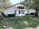 Single story home with a large sunroom at 24947 Cranes Roost Cir, Leesburg, FL 34748