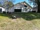 Single-story home on a grassy lot at 24947 Cranes Roost Cir, Leesburg, FL 34748