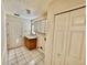 Laundry room with built-in cabinets and exterior access at 24947 Cranes Roost Cir, Leesburg, FL 34748